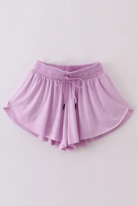 Purple woman sports shorts